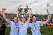 18 September 2011; Dublin players Paul Brogan, left, Paul Flynn, and Ross MCConnell, right, celebrate with the Sam Maguire cup after the game. GAA Football All-Ireland Senior Championship Final, Kerry v Dublin, Croke Park, Dublin. Picture credit: Ray McManus / SPORTSFILE