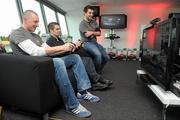 13 October 2011; Formula 1 enthusiasts Kieran Donaghy, Kerry footballer, and Bernard Dunne, retired boxer, with Jamie Barbour, Xbox, lined out earlier today to unveil the latest installment of Forza Motorsport 4 at the exclusive Forza Motorsport 4 event at Mondello Park International Racing Circuit. The release of “Forza Motorsport 4” across Ireland will usher in a new dawn for racing games and automotive entertainment. Developed by Turn 10 Studios and published by Microsoft Studios exclusively for Xbox 360, “Forza Motorsport 4” has set a new industry standard in this latest installment to the acclaimed “Forza Motorsport” franchise, the highest rated racing franchise of this generation. Mondello, Donore, Naas, Co. Kildare. Picture credit: Pat Murphy / SPORTSFILE