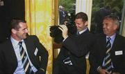 22 October 2003; Selector Martin Carney laughs as Paul McGrane 'photographs' his team-mate Steven McDonnell at the Reception, to honour both teams, in Government House, Perth, Western Australia. Picture credit; Ray McManus / SPORTSFILE