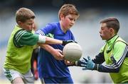 21 April 2017; Ryan Fitzgerald, representing C.o Monaghan, in action against Phillip Elliott, left, and Jack Carolan, representing Co Monaghan, during the Go Games Provincial Days in partnership with Littlewoods Ireland Day 7 at Croke Park in Dublin. Photo by Cody Glenn/Sportsfile