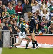 17 October 2004; Steven McDonnell, Ireland, in action against Mark McVeigh, Australia. Coca Cola International Rules Series 2004, First Test, Ireland v Australia, Croke Park, Dublin. Picture credit; Brendan Moran / SPORTSFILE *** Local Caption *** Any photograph taken by SPORTSFILE during, or in connection with, the 2004 Coca Cola International Rules Series which displays GAA logos or contains an image or part of an image of any GAA intellectual property, or, which contains images of a GAA player/players in their playing uniforms, may only be used for editorial and non-advertising purposes.  Use of photographs for advertising, as posters or for purchase separately is strictly prohibited unless prior written approval has been obtained from the Gaelic Athletic Association.