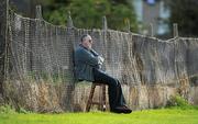 16 October 2011; A spectator sits on a stool watching the game. Dublin County Senior Football Championship Round 4, UCD v St Vincent’s, O’Toole Park, Dublin. Picture credit: Brendan Moran / SPORTSFILE