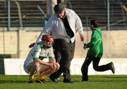 16 October 2011; Clonoulty-Rossmore goalkeeper Declan O'Dwyer is given a pat on the back from umpire Paddy McMahon, from Burgess, Co. Tipperary, after defeat to Drom & Inch. Tipperary County Senior Hurling Championship Final, Drom & Inch v Clonoulty-Rossmore, Semple Stadium, Thurles, Co. Tipperary. Picture credit: Diarmuid Greene / SPORTSFILE