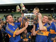 16 October 2011; Summerhill's Paul Comey, left, his son Caolan and Stephen Husband celebrate with the Keegan cup. Meath County Senior Football Championship Final Replay, Dunshaughlin v Summerhill, Pairc Tailteann, Navan, Co. Meath. Picture credit: Pat Murphy / SPORTSFILE