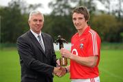 18 October 2011; Days before he flies out to Australia to play with the International Rules team, Cork forward Aidan Walsh has been voted the 2011 Bord Gáis Energy Breaking Through Player of the Year. The Kanturk clubman was picked from a shortlist that included heavy hitters Liam Rushe and Shane Dowling to claim the €1,000 prize voucher. Also in the running were Galway trio Niall O’Donoghue, Niall Burke and Barry Daly and Shane Dowling’s Limerick team mate Declan Hannon. The Breaking Through Player of the Year award recognises the overall stand out player of the 2011 Championship and is voted for by a panel made up of Bord Gáis Energy Sport Sponsorship Manager and newly appointed Cork selector, Ger Cunningham, RTÉ’s Marty Morrissey, Micheál O Domhnaill of TG4, U-21 All-Ireland winner Joe Canning and former Waterford great Ken McGrath. Pictured at the presentation are Bord Gáis Energy Sport Sponsorship Manager and newly appointed Cork selector, Ger Cunningham and Aidan Walsh. CIT GAA Grounds, Cork. Picture credit: Pat Murphy / SPORTSFILE