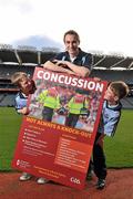 19 October 2011; The GAA has teamed up with brain injury specialists Acquired Brain Injury Ireland to back their Mind Your Head campaign; educating players about the signs and symptoms of Concussion, through an Educational Concussion Poster Campaign. This poster campaign will be distributed to over 1800 GAA clubs throughout the country, reaching out to all players of every age and level. Present at the launch were Dublin Footballer Paul Griffin, with Sean O'Connell, left, age 9 from Stepaside, Co. Dublin and Mark Bailey, age 8 from Killiney, Co. Dublin. GAA and ABI Ireland Launch Concussion Awareness Campaign, Croke Park, Dublin. Picture credit: David Maher / SPORTSFILE