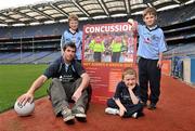 19 October 2011; The GAA has teamed up with brain injury specialists Acquired Brain Injury Ireland to back their Mind Your Head campaign; educating players about the signs and symptoms of Concussion, through an Educational Concussion Poster Campaign. This poster campaign will be distributed to over 1800 GAA clubs throughout the country, reaching out to all players of every age and level. Present at the launch were Dublin Footballer and ABI Ireland Ambassadors Michael Darragh Macauley, with children, left to right, Sean O'Connell, age 9, from Stepaside, Co. Dublin, his brother James O'Connell, age 5, and Mark Bailey, age 8, from Killiney, Co. Dublin. GAA and ABI Ireland Launch Concussion Awareness Campaign, Croke Park, Dublin. Picture credit: David Maher / SPORTSFILE