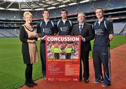 19 October 2011; The GAA has teamed up with brain injury specialists Acquired Brain Injury Ireland to back their Mind Your Head campaign; educating players about the signs and symptoms of Concussion, through an Educational Concussion Poster Campaign. This poster campaign will be distributed to over 1800 GAA clubs throughout the country, reaching out to all players of every age and level. Present at the launch are ABI Ireland CEO Barbara O’ Connell, with, from left to right, Dublin football players and ABI Ireland Ambassadors Michael Darragh Macauley, Rory O’Carroll, Dr. Danny Mulvihill, Chairman of the GAA Medical Committee, and Dublin footballer Paul Griffin. GAA and ABI Ireland Launch Concussion Awareness Campaign, Croke Park, Dublin. Picture credit: David Maher / SPORTSFILE