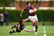 23 April 2017; Conor O’Brien of Clontarf evades the tackle of Calvin Nash of Young Munster during the Ulster Bank League Division 1A semi-final match between Clontarf and Young Munster at Castle Avenue, Clontarf, in Dublin. Photo by Seb Daly/Sportsfile