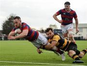 23 April 2017; Rob McGrath of Clontarf goes over to score his side's fifth try despite the tackle of Abrie Griesel of Young Munster during the Ulster Bank League Division 1A semi-final match between Clontarf and Young Munster at Castle Avenue, Clontarf, in Dublin. Photo by Seb Daly/Sportsfile
