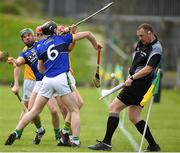 23 April 2017; Linesman Alan Kelly tries to avoid the action between Sean Quigley of Meath and Bryan Murphy of Kerry during the Leinster GAA Hurling Senior Championship Qualifier Group Round 1 match between Meath and Kerry at Pairc Tailteann, in Navan. Photo by Matt Browne/Sportsfile