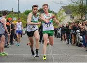 23 April 2017; Kevin Dooney, Raheny Shamrock AC, releases Conor Dooney to set off on the last leg, during the Men's Senior relay race, during the Irish Life Health National Road Relays at Raheny Village, in Dublin. Photo by Tomás Greally/Sportsfile