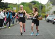 23 April 2017; Annmarie McGlynn, left,  releases Irene McFadden, from Letterkenny AC, Co. Donegal on their way to winning the Master Women's relay race, during Irish Life Health National Road Relays at Raheny Village, in Dublin. Photo by Tomás Greally/Sportsfile