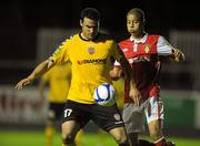 21 October 2011; Eamon Zayed, Derry City, in action against Jake Carroll, St Patrick's Athletic. Aitricity League Premier Division, St Patrick's Athletic v Derry City, Richmond Park, Dublin. Picture credit: Barry Cregg / SPORTSFILE