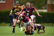 23 April 2017; Mick McGrath of Clontarf is tackled by Jack Harrington of Young Munster during the Ulster Bank League Division 1A semi-final match between Clontarf and Young Munster at Castle Avenue, Clontarf, in Dublin. Photo by Seb Daly/Sportsfile