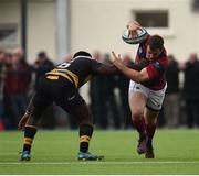 23 April 2017; Bryan Byrne of Clontarf is tackled by Elie Mundu of Young Munster during the Ulster Bank League Division 1A semi-final match between Clontarf and Young Munster at Castle Avenue, Clontarf, in Dublin. Photo by Seb Daly/Sportsfile