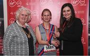 23 April 2017; Rachel Riordan is presented with her award from Annette Nidhathlaoi, right, Marketing, Virgin Media, and Georgina Drumm, left, President of Athletics Ireland, after placing third in women's category in the Virgin Media Night Run at Spencer Dock Hotel, in Dublin. Photo by Cody Glenn/Sportsfile