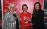 23 April 2017; Edel Gaffney is presented with her award from Annette Nidhathlaoi, right, Marketing, Virgin Media, and Georgina Drumm, left, President of Athletics Ireland, after placing second in women's category in the Virgin Media Night Run at Spencer Dock Hotel, in Dublin. Photo by Cody Glenn/Sportsfile