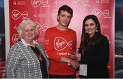 23 April 2017; Killian Mooney is presented with his award from Annette Nidhathlaoi, right, Marketing, Virgin Media, and Georgina Drumm, left, President of Athletics Ireland, after placing second in the Virgin Media Night Run at Spencer Dock Hotel, in Dublin. Photo by Cody Glenn/Sportsfile