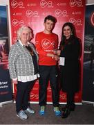 23 April 2017; Killian Mooney is presented with his award from Annette Nidhathlaoi, right, Marketing, Virgin Media, and Georgina Drumm, left, President of Athletics Ireland, after placing second in the Virgin Media Night Run at Spencer Dock Hotel, in Dublin. Photo by Cody Glenn/Sportsfile