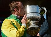 25 April 2017; Jockey Robbie Power celebrates with the trophy after winning the BoyleSport Champion Steeplechase on Fox Norton at Punchestown Racecourse in Naas, Co. Kildare. Photo by Cody Glenn/Sportsfile