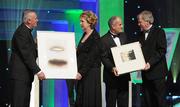 21 October 2011; Uachtarán CLG Criostóir Ó Cuana, and Ard Stiúrthóir of the GAA Páraic Duffy make a presentation, on behalf of the GAA, to President Mary McAleese and her husband Martin McAleese to recognise the contribution of the President to the GAA and Ireland during her term of office, at the GAA GPA All-Star Awards 2011 sponsored by Opel. National Convention Centre, Dublin. Picture credit: Brendan Moran / SPORTSFILE