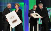 21 October 2011; Uachtarán CLG Criostóir Ó Cuana, and Ard Stiúrthóir of the GAA Páraic Duffy make a presentation, on behalf of the GAA, to President Mary McAleese and her husband Martin McAleese to recognise the contribution of the President to the GAA and Ireland during her term of office, at the GAA GPA All-Star Awards 2011 sponsored by Opel. National Convention Centre, Dublin. Picture credit: Brendan Moran / SPORTSFILE