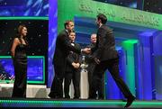 21 October 2011; Dublin footballer Michael Darragh Macauley is greeted by Dave Sheeran, Managing Director, Opel Ireland, before receiving his award from Uachtarán CLG Criostóir Ó Cuana at the GAA GPA All-Star Awards 2011 sponsored by Opel. National Convention Centre, Dublin. Picture credit: Brendan Moran / SPORTSFILE