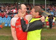 23 October 2011; Ballintubber manager Anthony McGarry  celebrates with Gary Dillon at the end of the game. Mayo County Senior Football Championship Final, Castlebar Mitchels v Ballintubber, McHale Park, Castlebar, Co. Mayo. Picture credit: David Maher / SPORTSFILE