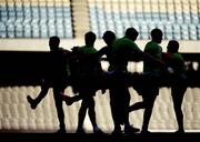 27 October 2011; A group of Ireland players warm up before squad training ahead of their first International Rules match against Australia on Friday October 28th. Ireland Training - International Rules Series 2011, Etihad Stadium, Melbourne, Australiaa. Picture credit: Ray McManus / SPORTSFILE