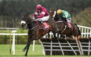 26 April 2017; Champagne Classic, left, with Bryan Cooper up, jump the last on their way to winning the Irish Daily Mirror Novice Hurdle at Punchestown Racecourse in Naas, Co. Kildare. Photo by Seb Daly/Sportsfile