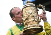 26 April 2017; Robbie Power kisses the trophy after winning the Coral Punchestown Gold Cup on Sizing John at Punchestown Racecourse in Naas, Co. Kildare. Photo by Seb Daly/Sportsfile