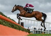 26 April 2017; Devils Bride, with Dylan Robinson up, jump the third during the Guinness Handicap Steeplechase at Punchestown Racecourse in Naas, Co. Kildare. Photo by Seb Daly/Sportsfile