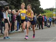 23 April 2017; Ellie Hartnett, left, from UCD AC, releases Ciara Everard from UCD AC, during the Senior Women's relay race, at the Irish Life Health National Road Relays at Raheny Village, in Dublin. Photo by Tomás Greally/Sportsfile