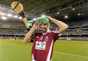 28 October 2011; Former Clare star Tony Griffin adjusts his helmet before lining out for Clarinbridge in the game. 2011 Australiasian All Stars v Clarinbridge, Etihad Stadium, Melbourne, Australia. Picture credit: Ray McManus / SPORTSFILE