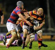 28 October 2011; Ron Boucher, Lansdowne, is tackled by Ben Reilly and Sam Cronin, hidden, Clontarf. Ulster Bank League Division 1A, Clontarf v Lansdowne, Castle Avenue, Clontarf, Dublin. Picture credit: Pat Murphy / SPORTSFILE