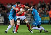 28 October 2011; Denis Leamy, Munster, is tackled by Fabio Ongaro and Fabio Staibano, Aironi. Celtic League, Munster v Aironi, Musgrave Park, Cork. Picture credit: Matt Browne / SPORTSFILE