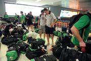 29 October 2011; Ireland's Darren Hughes and Kevin Reilly, right, in Melbourne Airport after Qantas flight QF458 to Sydney was cancelled as they waited in Gate 23. The Australian airline Qantas grounded all international and domestic flights with immediate effect due to an industrial dispute moments before the Ireland team were scheduled to depart for Sydney for the 2nd International Rules Test against Australia. Melbourne Airport, Australia. Picture credit: Ray McManus / SPORTSFILE