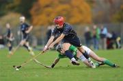 29 October 2011; Daniel Cameron, Scotland, in action against Brendan Murtagh, Ireland. Senior Hurling / Shinty International 2nd Test, Scotland v Ireland, Bught Park, Inverness, Scotland. Picture credit: Barry Cregg / SPORTSFILE