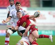 29 October 2011; Tavis Knoyle, Scarlets, gets the ball away despite the tackle of Tom Court, Ulster. Celtic League, Scarlets v Ulster, Parc Y Scarlets, Llanelli, Wales. Picture credit: Steve Pope / SPORTSFILE
