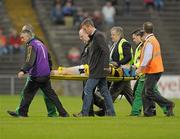 30 October 2011; Johnny Hanratty, Crossmaglen Rangers, is stretchered off the field with an injury. AIB Ulster GAA Football Senior Club Championship Quarter-Final, St. Galls v Crossmaglen Rangers, Casement Park, Belfast, Co. Antrim. Photo by Sportsfile