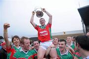 30 October 2011; James Stephen's captain Jackie Tyrrell with the Tom Walsh Cup is lifted by his team-mates. Kilkenny County Senior Hurling Championship Final Replay, Ballyhale Shamrocks v James Stephen's, Nowlan Park, Kilkenny. Picture credit: Matt Browne / SPORTSFILE