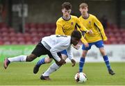 29 April 2017; Favour Eddy of Tramore AFC in action against Adam O'Driscoll of Carrigaline United AFC during the FAI Umbro U17 Challenge cup final match between Carrigaline United AFC and Tramore AFC at Turners Cross in Cork. Photo by Matt Browne/Sportsfile