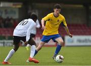 29 April 2017; Christian Buttimer of Carrigaline United AFC in action against Mohammed Ajala of Tramore AFC during the FAI Umbro U17 Challenge cup final match between Carrigaline United AFC and Tramore AFC at Turners Cross in Cork. Photo by Matt Browne/Sportsfile