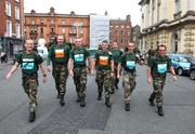 31 October 2011; Members from the 15th Batallion, McKee Barracks, from left to right, Niall Keleghan, Dublin, Robert Byrne, Porlaoise, Co. Laois, Alan Hayes, Clondalkin, Co. Dublin, Brian Kelly, Rathnew, Co. Wicklow, Wayne Kelly, Ratoath , Co. Meath, Colm Gray, Navan, Co. Meath, on their way to the start of the 2011 National Lottery Dublin Marathon. Dublin. Picture credit: Tomas Greally / SPORTSFILE