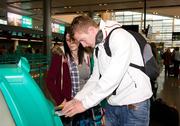 31 October 2011; GPA’s UNICEF Ambassador Galway hurling star Joe Canning and UNICEF Ireland Communications manager Julianne Savage checking in at Dublin airport bound for Swaziland as part of an Irish delegation visiting UNICEF projects in the South African country. Dublin Airport, Dublin. Picture credit: Barry Cregg / SPORTSFILE
