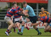 30 April 2017; Jack Regan of UCD is tackled by Dylan Murray, left and Andrew Feeney of Clontarf during the McCorry Cup Final between UCD and Clontarf at St. Mary's RFC in Dublin. Photo by Sam Barnes/Sportsfile