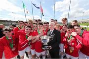 30 April 2017; FAI President Tony Fitzgerald presents the cup to Leeside AFC after the FAI Umbro Youth Cup Final match between Aisling Annacotty and Leeside AFC at Jackman Park in Limerick. Photo by Keith Wiseman/Sportsfile