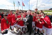 30 April 2017; FAI President Tony Fitzgerald presents the cup to Leeside AFC after the FAI Umbro Youth Cup Final match between Aisling Annacotty and Leeside AFC at Jackman Park in Limerick. Photo by Keith Wiseman/Sportsfile