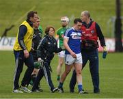 30 April 2017; Willie Dunphy of Laois, who was injured late in the game, is assisted by the Dr Sharon McDonald and chartered physiotherapist Enday Lyons as he leaves the field during the Leinster GAA Hurling Senior Championship Qualifier Group Round 2 match between Meath and Laois at Pairc Tailteann in Meath. Photo by Ray McManus/Sportsfile